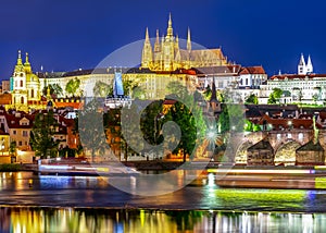 Prague castle with St. Vitus cathedral and Charles bridge at night, Czech Republic