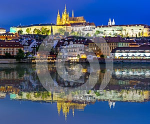 Prague Castle with St. Vitus Cathedral over Lesser town Mala Strana reflected in Vltava river, Czech Republic