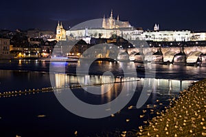 Prague Charles bridge and Hradcany castle at night photo