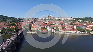 Prague city bridge over the river aerial view