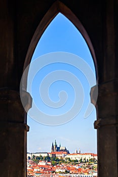 Prague city through gothic lancet window