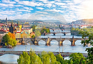 Prague cityscape with bridges over Vltava river at summer sunset, Czech Republic