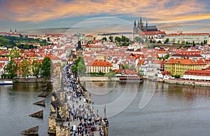 Prague cityscape with Charles Bridge over Vltava river and Prague castle at sunset, Czech Republic