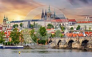 Prague cityscape with Hradcany castle and Charles bridge at sunset, Czech Republic