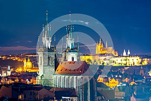 Prague cityscape at night with church of Our Lady before Tyn and Prague castle at background, Czech Republic