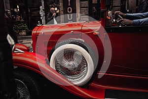 Prague. 10.05.2019: Classic retro car stands on the street at the exhibition. Multi-colored, red vintage. The concept of antiquity