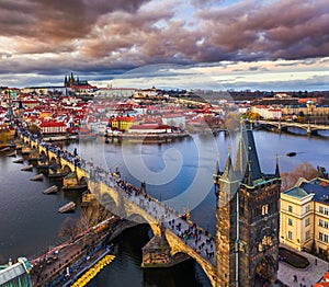 Prague, Czech Republic - Aerial drone view of the world famous Charles Bridge Karluv most above River Vltava at sunset