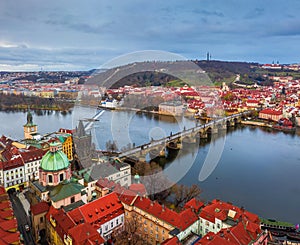 Prague, Czech Republic - Aerial panoramic drone view of St. Francis Of Assisi Church with the famous Charles Bridge Karluv most photo