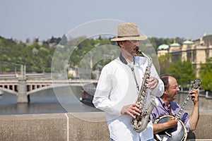 Prague, Czech Republic - April 19, 2011: Quartet of Musicians playing musical instruments for tourists on the street in Prague