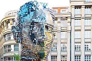 PRAGUE, CZECH REPUBLIC - AUGUST 17, 2018: Statue of Franz Kafka. Glossy metal mechanical sculpture of famous Czech