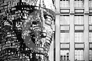 PRAGUE, CZECH REPUBLIC - AUGUST 17, 2018: Statue of Franz Kafka. Glossy metal mechanical sculpture of famous Czech