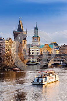 Prague, Czech Republic - Beautiful golden sunset and blue sky at the world famous Charles Bridge Karluv most photo