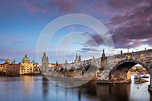 Prague, Czech Republic - Beautiful purple sunset and sky at the world famous Charles Bridge Karluv most