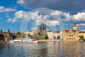 Prague, Czech Republic, Charles Bridge across Vltava river on which the ship sails.