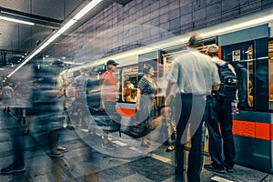Prague, Czech Republic,23 July 2019; People at metro station entering subway train, long exposure technique for movement. Urban