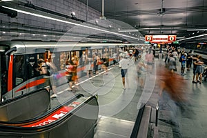 Prague, Czech Republic,23 July 2019; People at metro station entering subway train or walking by, long exposure technique for