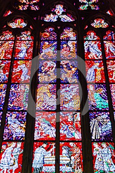 Colorful religious stained glass window, St. Vitus Cathedral in