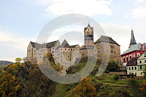 Prague, Czech Republic, September 29, 2017: Lockett Castle on the River Eger. Castle in the Czech Republic. Autumn. Blue sky. photo