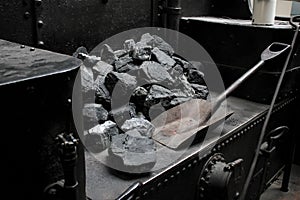 Prague, Czech Republic - September 23, 2017: Steam locomotive in national technical museum in Prague, Czech Republic. Pile of coal