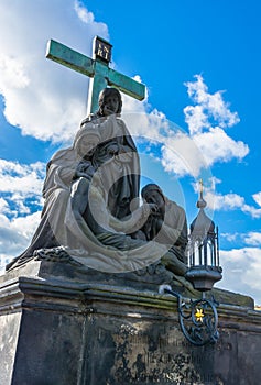 Statue of Pieta on Charles Bridge in Prague photo