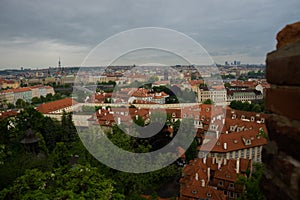 Prague, Czech Republic: Top view to red roofs skyline of Prague city, Czech Republic. Aerial view of Prague city with terracotta