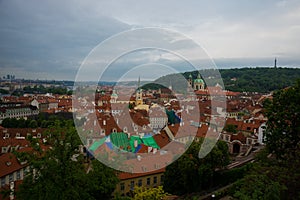 Prague, Czech Republic: Top view to red roofs skyline of Prague city, Czech Republic. Aerial view of Prague city with terracotta