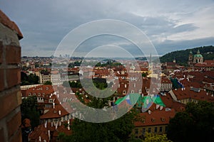 Prague, Czech Republic: Top view to red roofs skyline of Prague city, Czech Republic. Aerial view of Prague city with terracotta