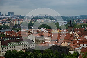 Prague, Czech Republic: Top view to red roofs skyline of Prague city, Czech Republic. Aerial view of Prague city with terracotta