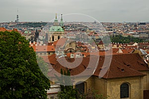 Prague, Czech Republic: Top view to red roofs skyline of Prague city, Czech Republic. Aerial view of Prague city with terracotta