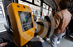 Yellow ticket validator inside Prague tram