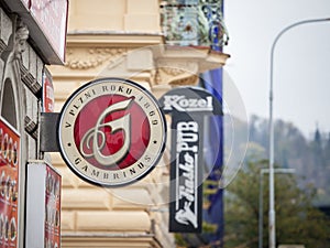 Gambrinus logo in front of a local retailer bar in Prague.