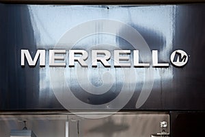 Merrell logo in front of their retailer shop for Prague.