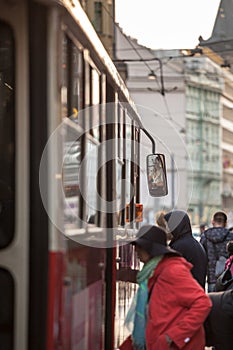 Prague tram, or called Prazske tramvaje, Tatra T3 model, crowded with commuters entering.