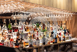 Prague - December. 12, 2023: Bottles of whiskey rum and other spirits in the restaurant bar. A large assortment of alcoholic