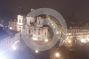 Prague in foggy evening