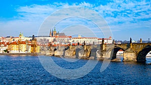 Prague Hradcany Panorama on sunny day. Charles Bridge over Vltava River with Prague Castle, Czech Republic