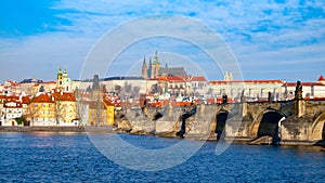 Prague Hradcany Panorama on sunny day. Charles Bridge over Vltava River with Prague Castle, Czech Republic