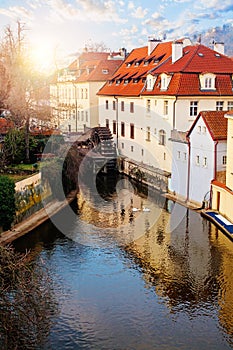 Prague landmark. Certovka river and and old water wheel mill in Prague