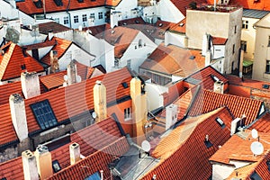 Prague Old Town Square row houses with traditional red roofs in