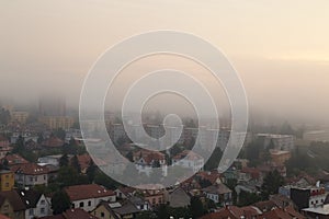 Prague`s residential district in foggy early morning. Building`s silhouettes through morning fog.