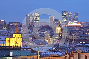 Prague - spires of the old town and office high-rises at dusk