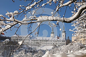Prague Strahov Monastery view through snowy tree branch