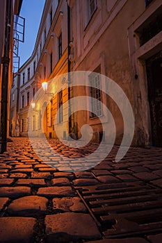 Prague street at night with sewer