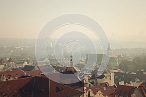 Prague tile roofs of old houses, view from above. vintage and nostalgic style photo