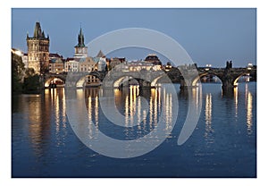 Prague tower and bridge by night