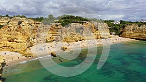 Praia da Marinha, beautiful beach Marinha in Algarve, Portugal. Navy Beach (Praia da Marinha) with flying seagulls