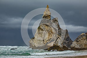 Praia da Ursa beach, stormy clouds near Cabo da Roca cape in Portugal,