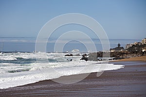 Praia de Carnero, sandy beach in Porto with big waves of the ocean photo