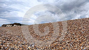 Colorful stone beach in Newhaven, clean blue water, England just beautiful! photo