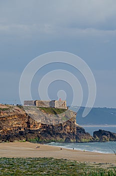 Praia do Norte beach, cliffs and NazarÃ© lighthouse cape